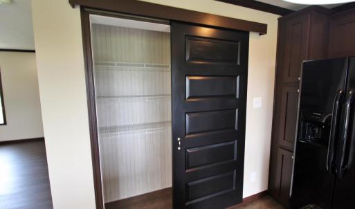 Sliding door pantry in kitchen
