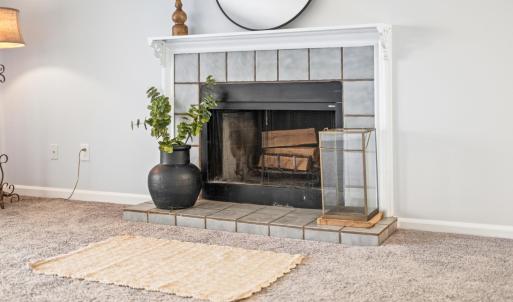 Wood burning fireplace in den
