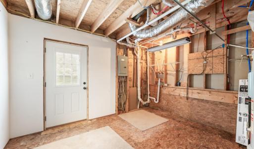 Laundry room walks out to back yard.