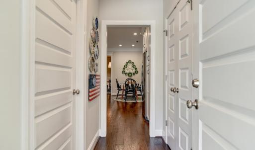 Garage Door entry - going past the Laundry Room, Pantry, and looking into the Kitchen breakfast seating area.