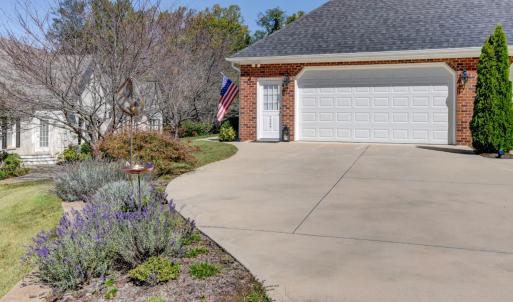Concrete Drive with double car smart garage entry and additional exterior door for home entry