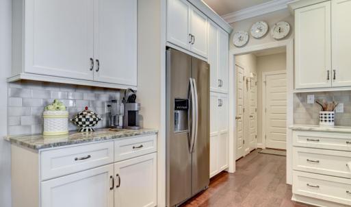 Kitchen View towards the Garage entry and Laundry Room & Pantry areas