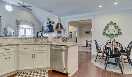 Kitchen - Sink and Dishwasher area and a view towards the great room, kitchen seating area, and formal dining room/front entry
