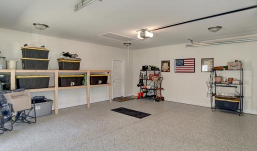 Large Garage with built in shelving and attic pull down access