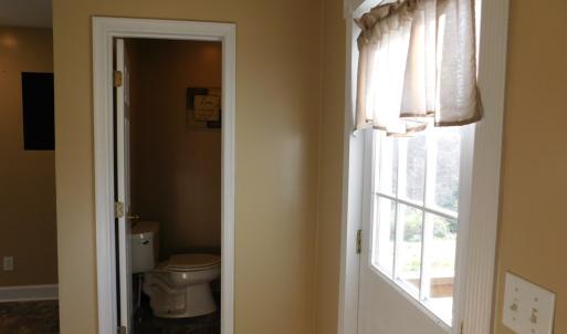 Back entry foyer looking into 1/2 bath