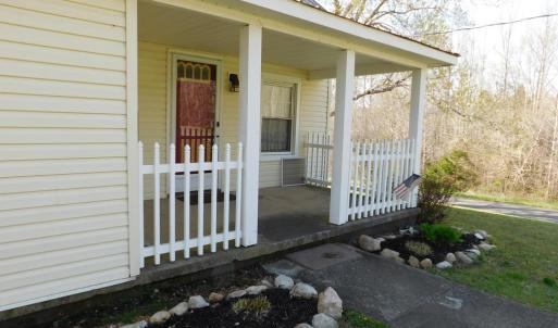 Front porch and flower beds. Landscaping just star