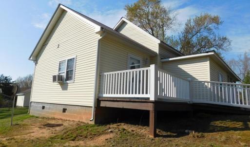 Left of House with view of large deck for your enj