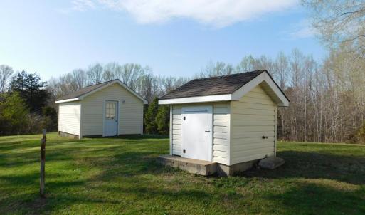 Well house with storage building in back.