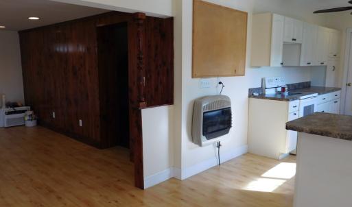 Dining  looking into living room and kitchen