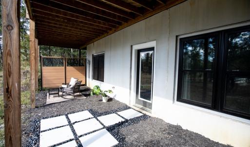 sitting outside walk out basement overlooking pond