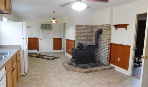 Kitchen - Fisher wood stove, door to garage