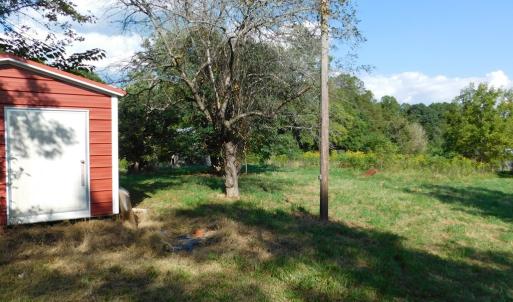 Storage building with lean to