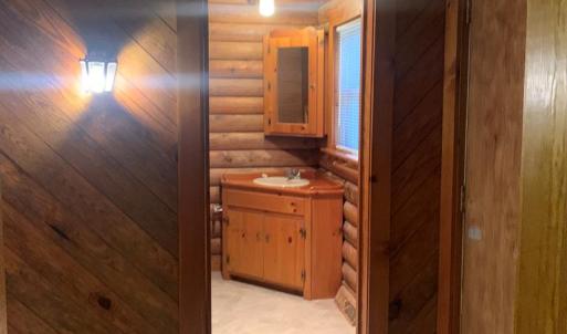 Hallway leading into Bathroom