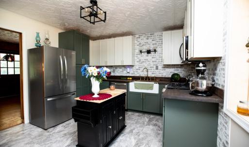 Kitchen, New appliances, new kitchen cabinets, farmhouse sink, & butcher block countertops.
