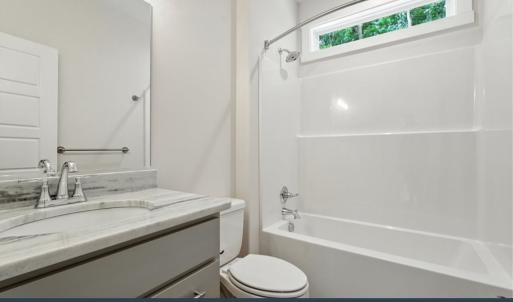 Hall Bathroom, Tub/Shower Combination, Transom Window, Granite Counters, LVP Flooring