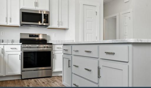 Kitchen, SS Dishwasher, Microwave, and Drop In Range Included