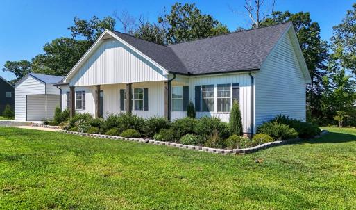 Landscaping and Established Lawn, Professionally Designed Landscaping with Established Lawn, Concrete Borders, and Thoughtfully Planned Plantings.