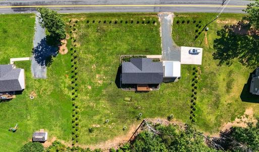 Arial View of Property, Established Apple and Peach Trees add beauty, seasonal enjoyment, and lasting value. 4 Arborvitae create Privacy, Beautiful Landscaping, and Year-Round Curb Appeal.