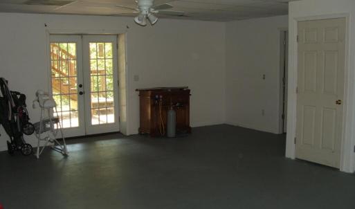 Large family room in basement.  French doors lead to patio.