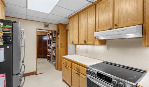 Primary Kitchen - Main Floor, The kitchen is the hub of the home, with spokes to the dining room, upstairs, downstairs, laundry center, living room, and office.