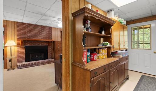 View into the Office / Sitting Room, A second fireplace with gas logs warms the office, perfect to chase off the chill when you come inside from the porch.