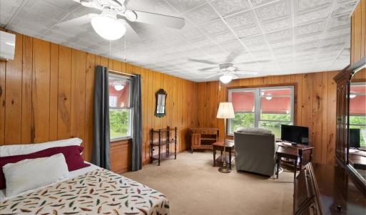 Primary Bedroom with Sitting Area, This spacious primary bedroom has a walk-in closet, room for a king-size bed, and a sitting area.
