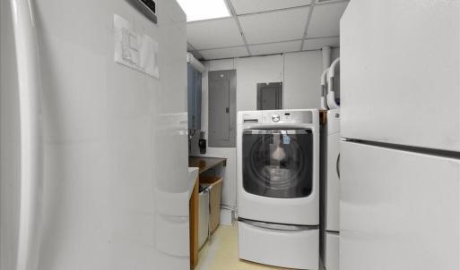 Utility Room, A Commercial On-Demand Hot Water Heater, Laundry Sink and Appliances, Freezer and an extra Refrigerator bring high functionality to the center of the home.