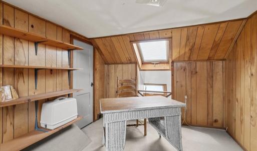 Loft Hall , This loft hall overlooks the kitchen and dining room. Skylights on both sides provide great natural lighting for a sewing or craft center space .