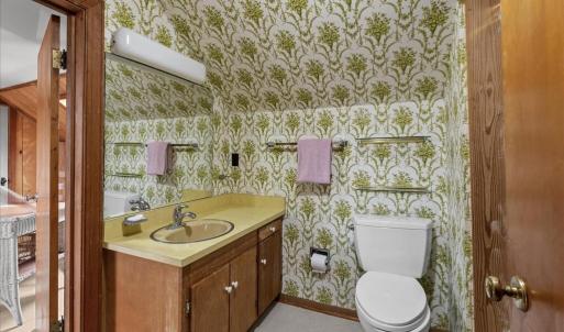 Full Bathroom on Second Floor, This is an ensuite to a second primary bedroom, and also has hall access serving the upstairs.
