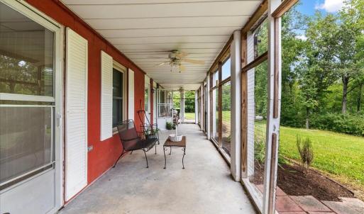 Ground Level Porch, Just steps away from the dock, this shady retreat immerses you in nature.  Separate entrances lead to two suites and a laundry center.