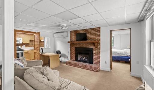 Living Room - Suite 1 Basement, Enjoy being cozy by the fireplace.