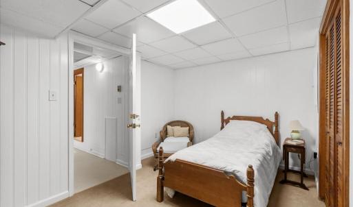 Swing Bedroom 6 - Basement, This can be an extra room for either suite in the basement, depending on which door is unlocked.