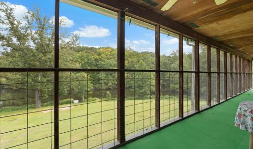 Wraparound Covered Porch - Main Level, A full-length covered porch provides outdoor dining, a canning stove, conversation areas, and access to serene immersion in nature.