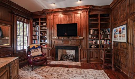 Study with rich walnut stained pine paneling
