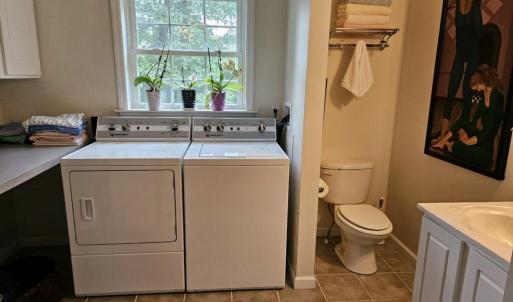 Hall bath with laundry in addition