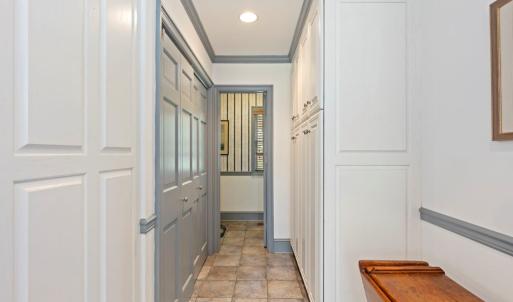 Hallway from kitchen leading to 1st floor half bat