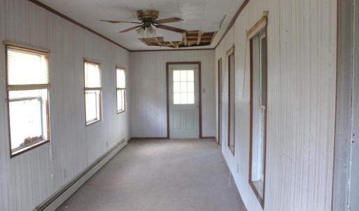 Enclosed front porch.