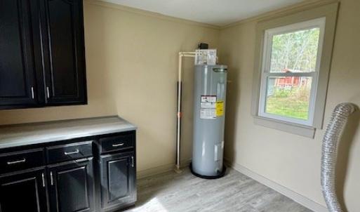 laundry room with cabinet and folding counter