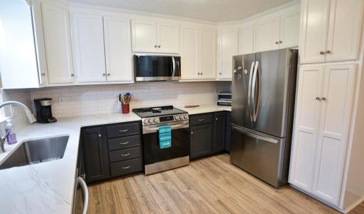 White Subway Tile Backsplash & Pantry Cabinet