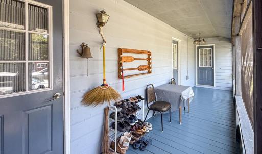 Screened in porch side of house