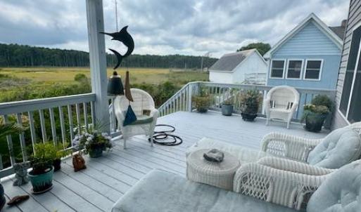 Open decks on both sides of covered porch.