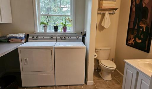 Hall bath with laundry in addition