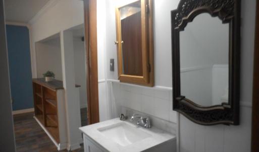 For convenience you can enter the downstairs bath from the LR as well as the kitchen.