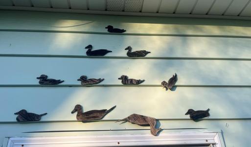 Door ducks, These darling ducks have been around as long as the home has: A "quack" reminder of the stories, seasons and smiles that have passed beneath their watch.