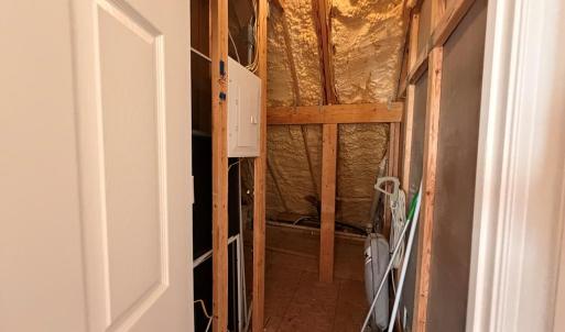 Upstairs storage, Has light.  Access through bedroom