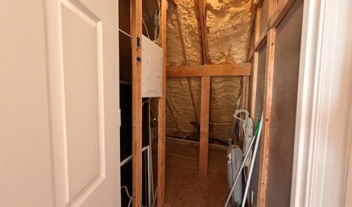 Upstairs storage, Has light.  Access through bedroom