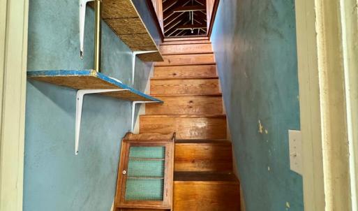 Stairs leading to upstairs bonus room