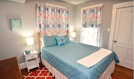 Second Floor Bedroom, This bedroom leads to a private balcony.