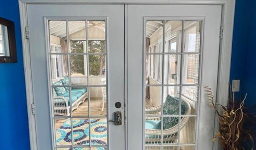 French doors to lovely screened porch