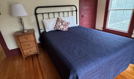 Bedroom 2 with door to walkup attic